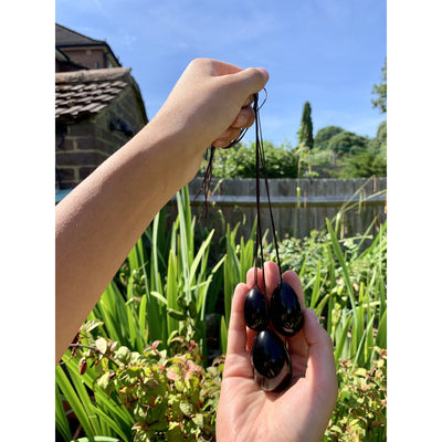 customer holding black yoni eggs 