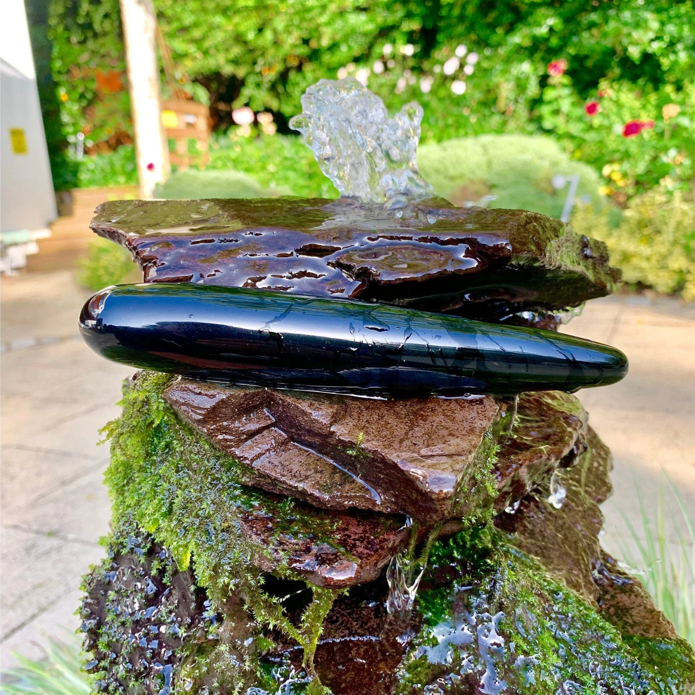 black obsidian large crystal yoni wand in mystical waterfall
